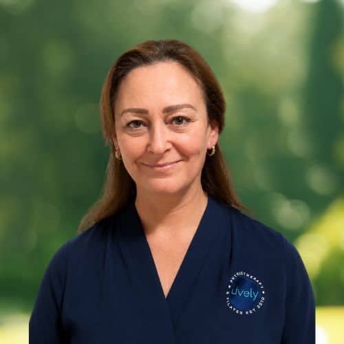 Brooke Kozlovsky, physiotherapist at Lively Physio, headshot smiling outdoors in navy uniform
